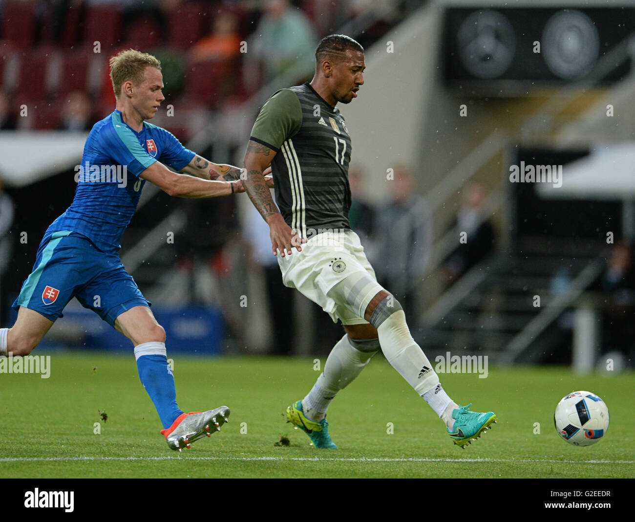 Augsburg, Germany. 29th May, 2016. Germany's Jerome Boateng (r) and Slovakia's Ondrej Duda in action during the international friendly match between Germany and Slovakia at WWK-Arena in Augsburg, Germany, 29 May 2016. PHOTO: ANDREAS GEBERT/dpa/Alamy Live News Stock Photo