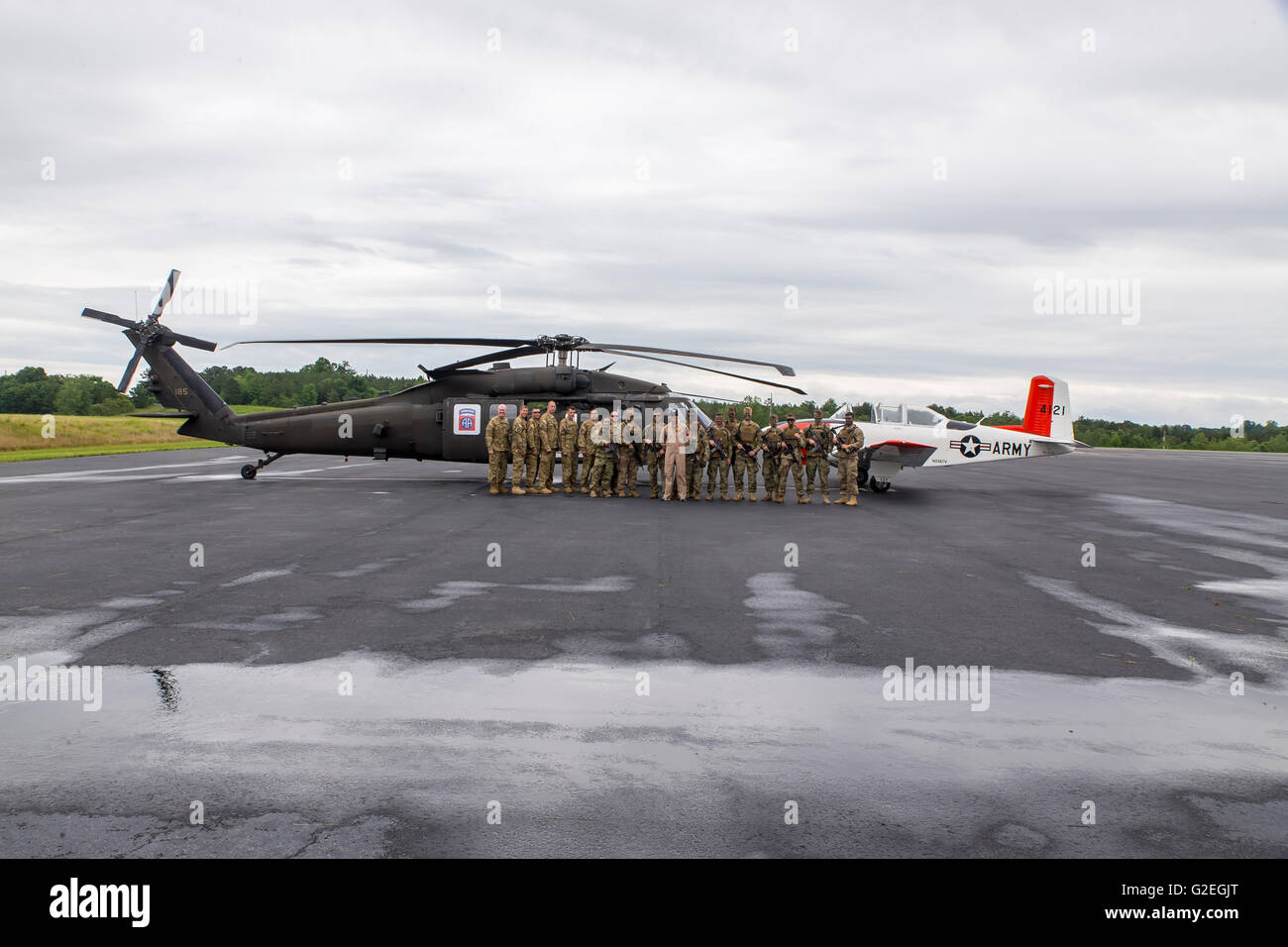 Concord, NC, USA. 29th May, 2016. Concord, NC - May 29, 2016: The 82nd Combat Aviation Brigade pose with their aircraft and some vintage airplanes before the Coca Cola 600 at the Charlotte Motor Speedway in Concord, NC. Credit:  csm/Alamy Live News Stock Photo