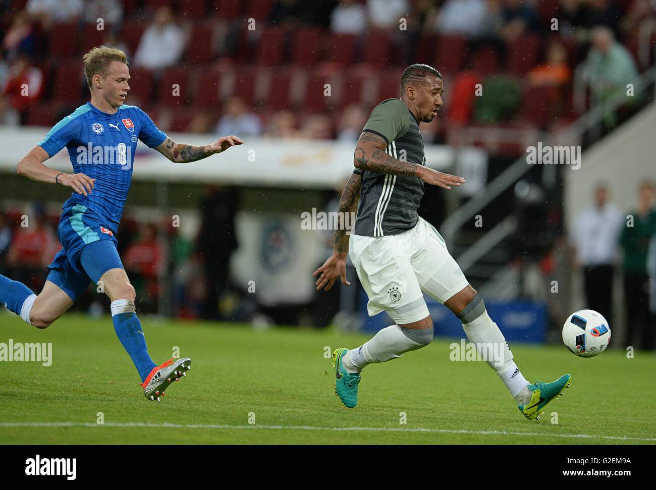 German's Jerome Boateng (R) and Slovakia's Ondrej Duda vie for the ball during the international soccer match between German and Slovakia in the WWK Arena in Augsburg, Germany, 29 May 2016. Photo: ANDREAS GEBERT/dpa Stock Photo