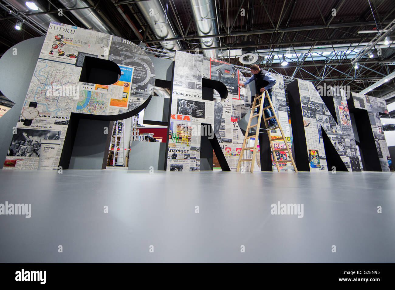 Duesseldorf, Germany. 30th May, 2016. The word 'Print' can be read in oversized letters during a photo tour of the 'Drupa' print media fair in Duesseldorf, Germany, 30 May 2016. Drupa, the world's largest trade fair for print media, takes place from 31 May until 10 June 2016 in Duesseldorf. Photo: ROLF VENNENBERND/dpa/Alamy Live News Stock Photo