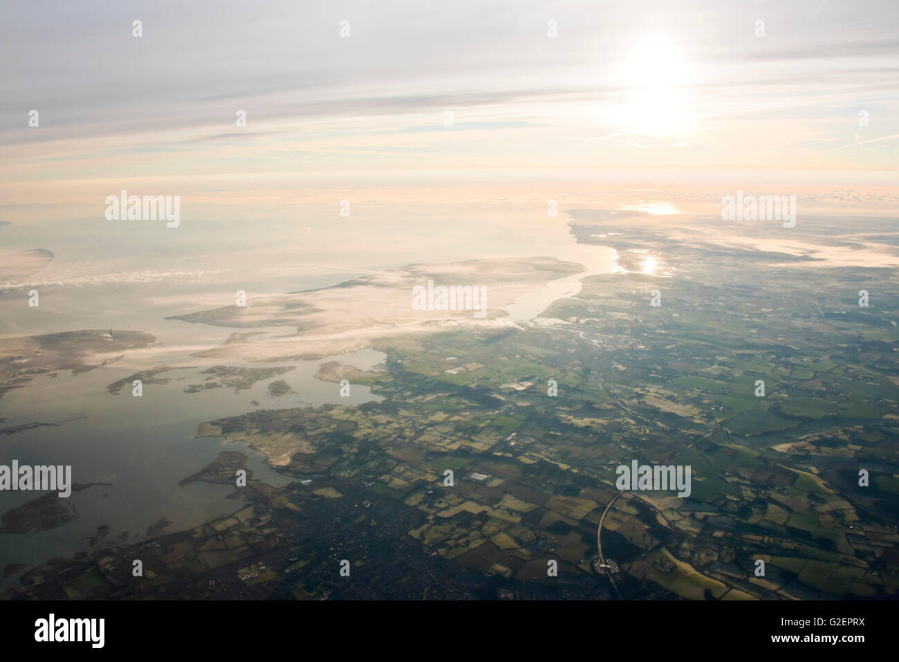Horizontal aerial view of the Isle of Sheppey and Thames estuary across the Kent countryside. Stock Photo