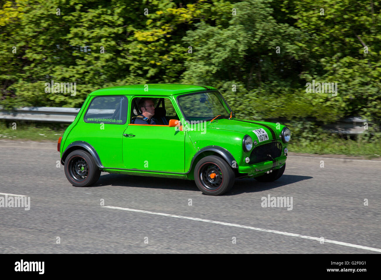1973 998cc Green Mini 1000 , side view motion blur; at Pendle Power Fest, a classic cars, veteran and heritage, 70s cherished oldtimers motor show in Lancashire, UK Stock Photo