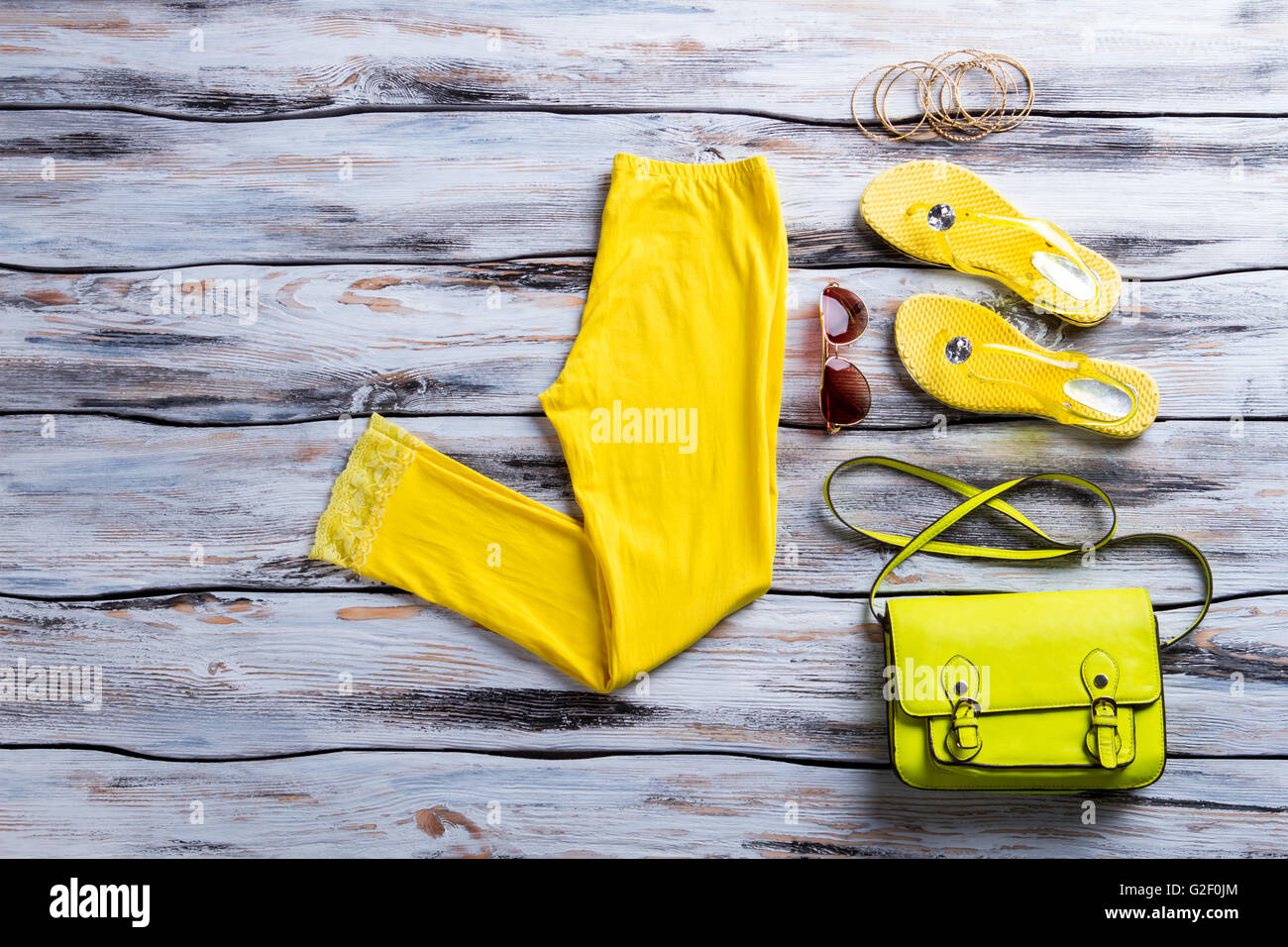 Yellow pants with lime purse Stock Photo Alamy