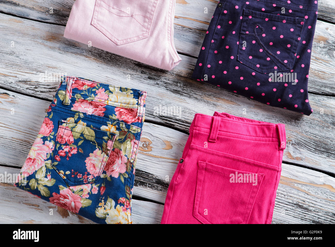 Folded pants with floral pattern. Stock Photo