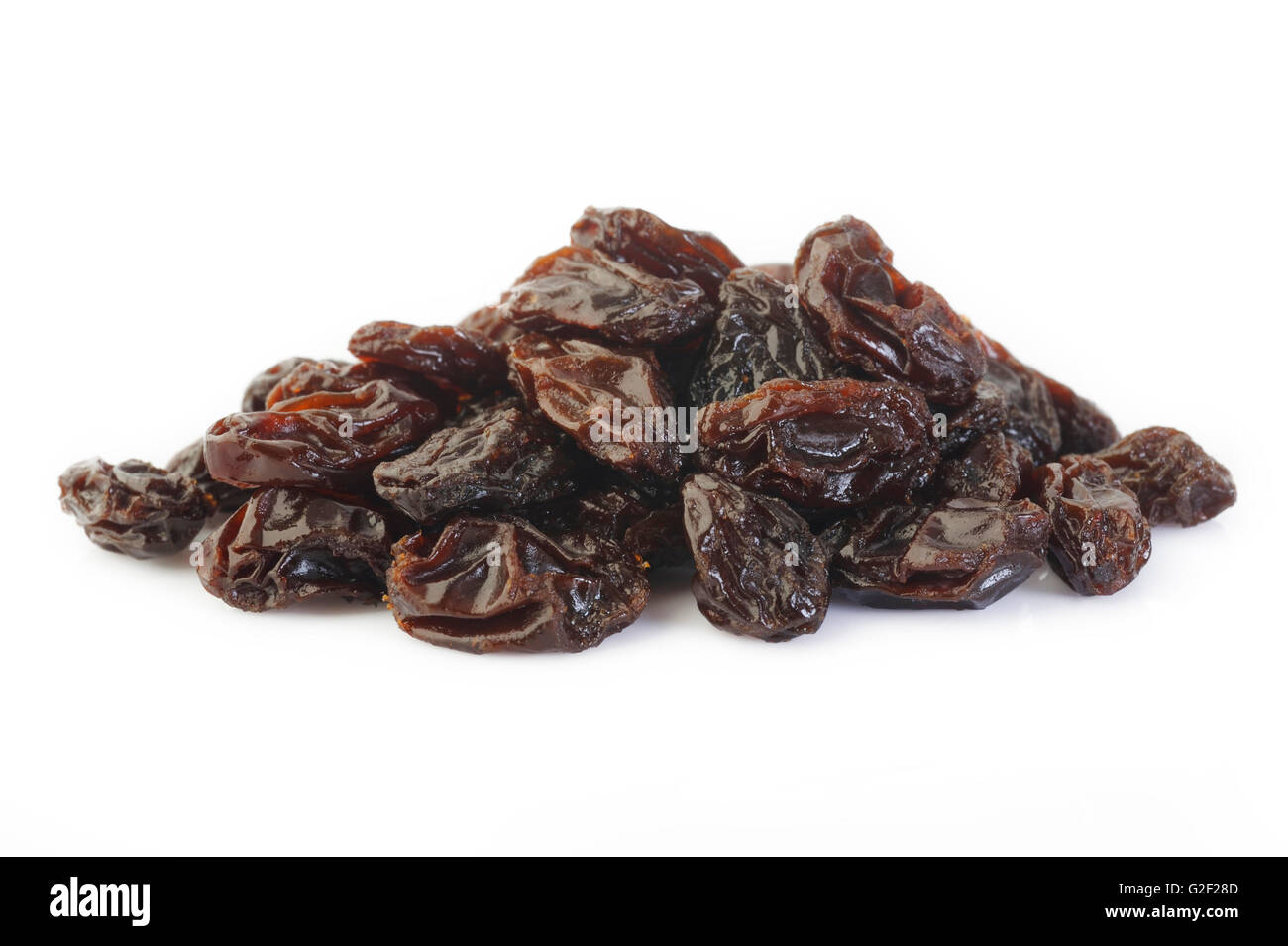 pile of raisins on white background Stock Photo