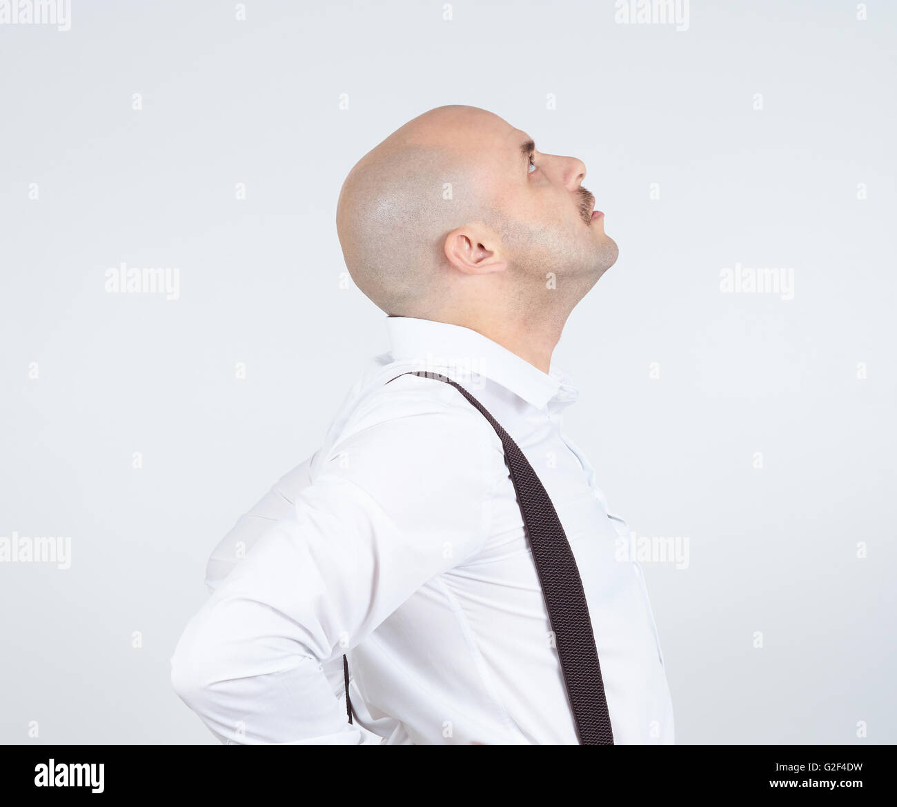 Bald man looking up. Side view. Thoughts, ideas. Stock Photo