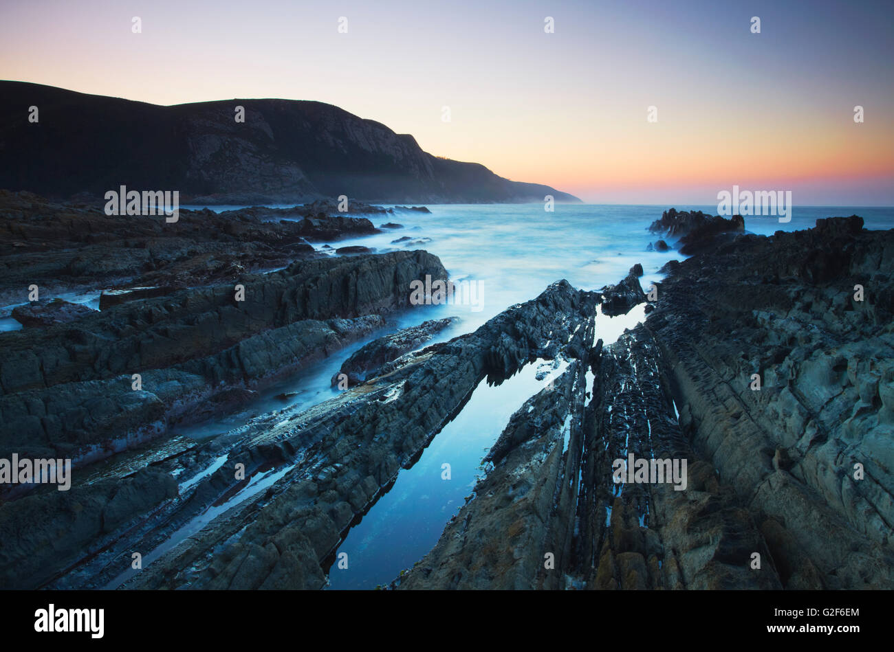 Coastline of Tsitsikamma National Park at dawn, Storms River, Eastern Cape, South Africa Stock Photo