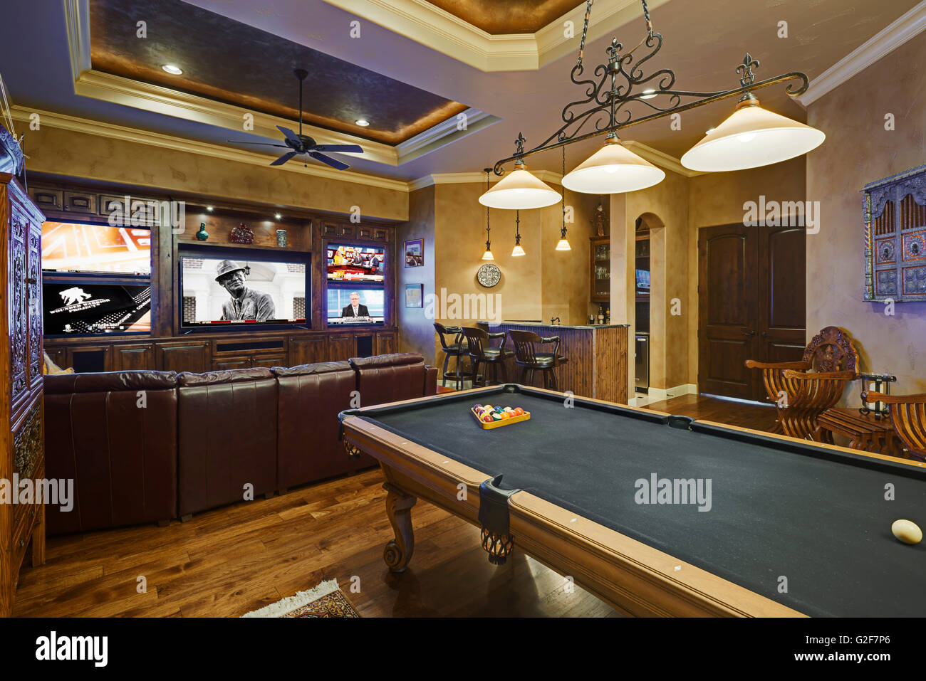 Game Room With Billiards Table and Flat Screen TV's Stock Photo