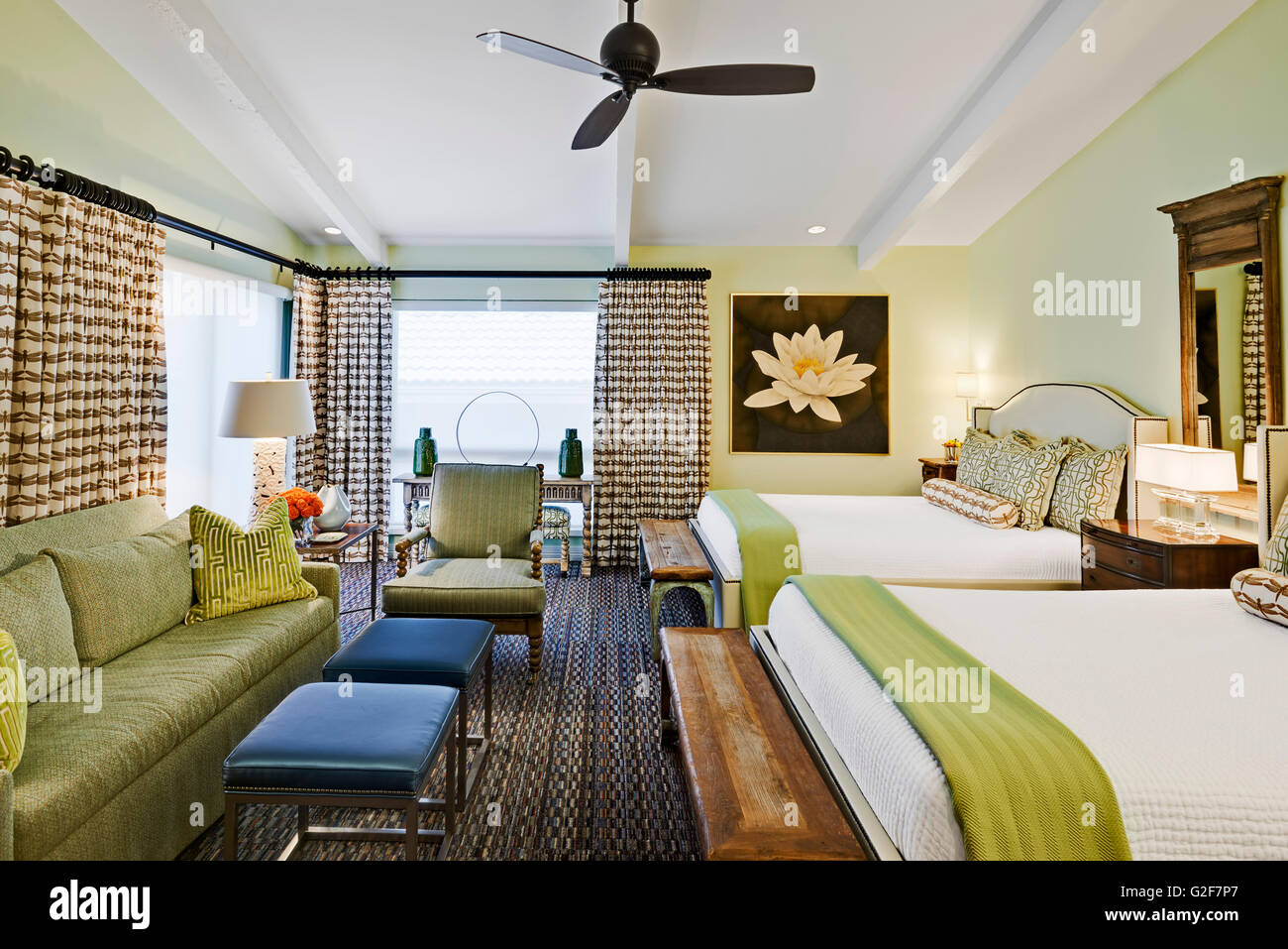 Hotel Room with Two Double Beds and Sitting Area Stock Photo