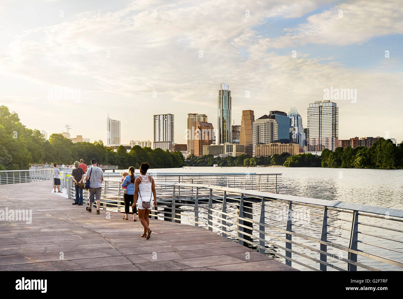 Boardwalk Along River with Skyline in Background, Austin, Texas, USA Stock Photo