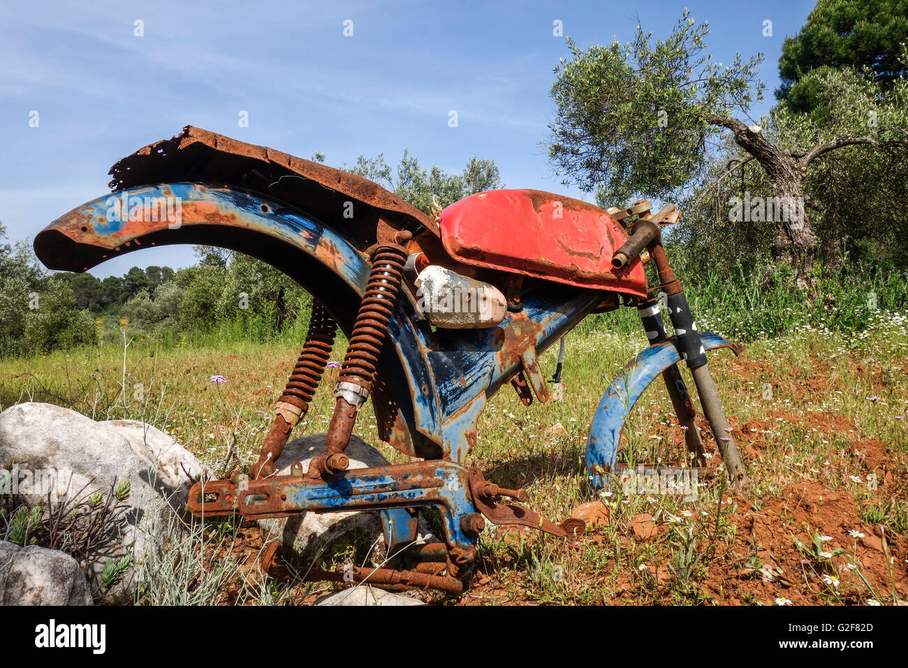Rusty Old dilapidated classic bike left behind in olive orchards, Spain. Stock Photo