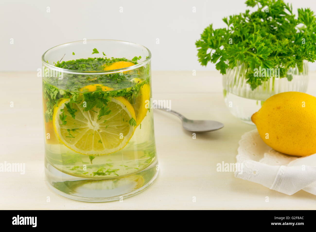 Water with parsley and lemon. Diet beverage Stock Photo Alamy