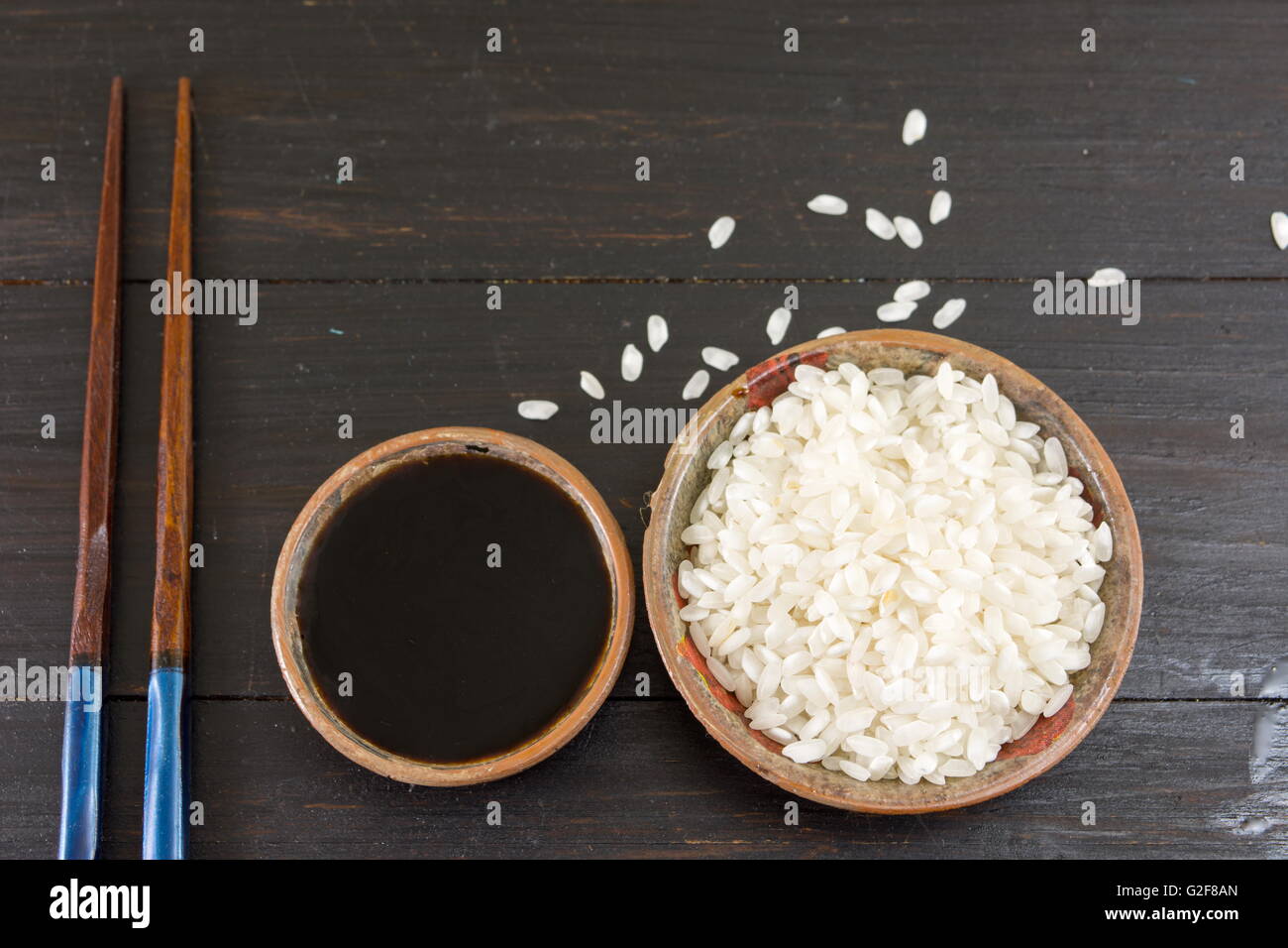 Rice soy sauce and chopsticks top view Stock Photo