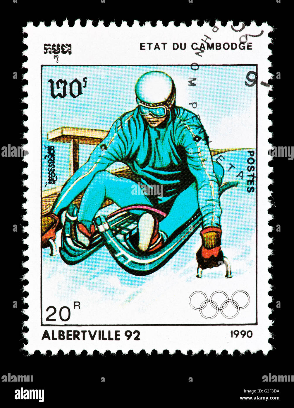 Postage stamp from Cambodia depicting a luger at the start, issued for the 1992 Olympic Games in Albertville, France. Stock Photo