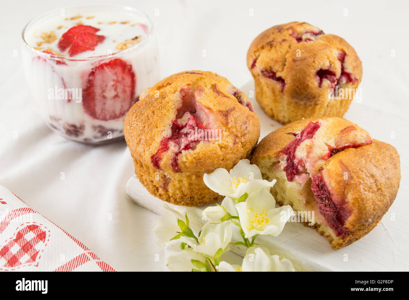 Strawberry muffins on a plate with strawberry parfait Stock Photo