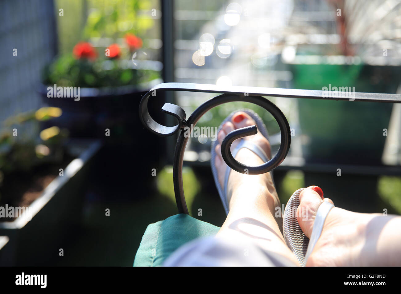 Relaxing on a balcony in summer, in London, England, UK Stock Photo