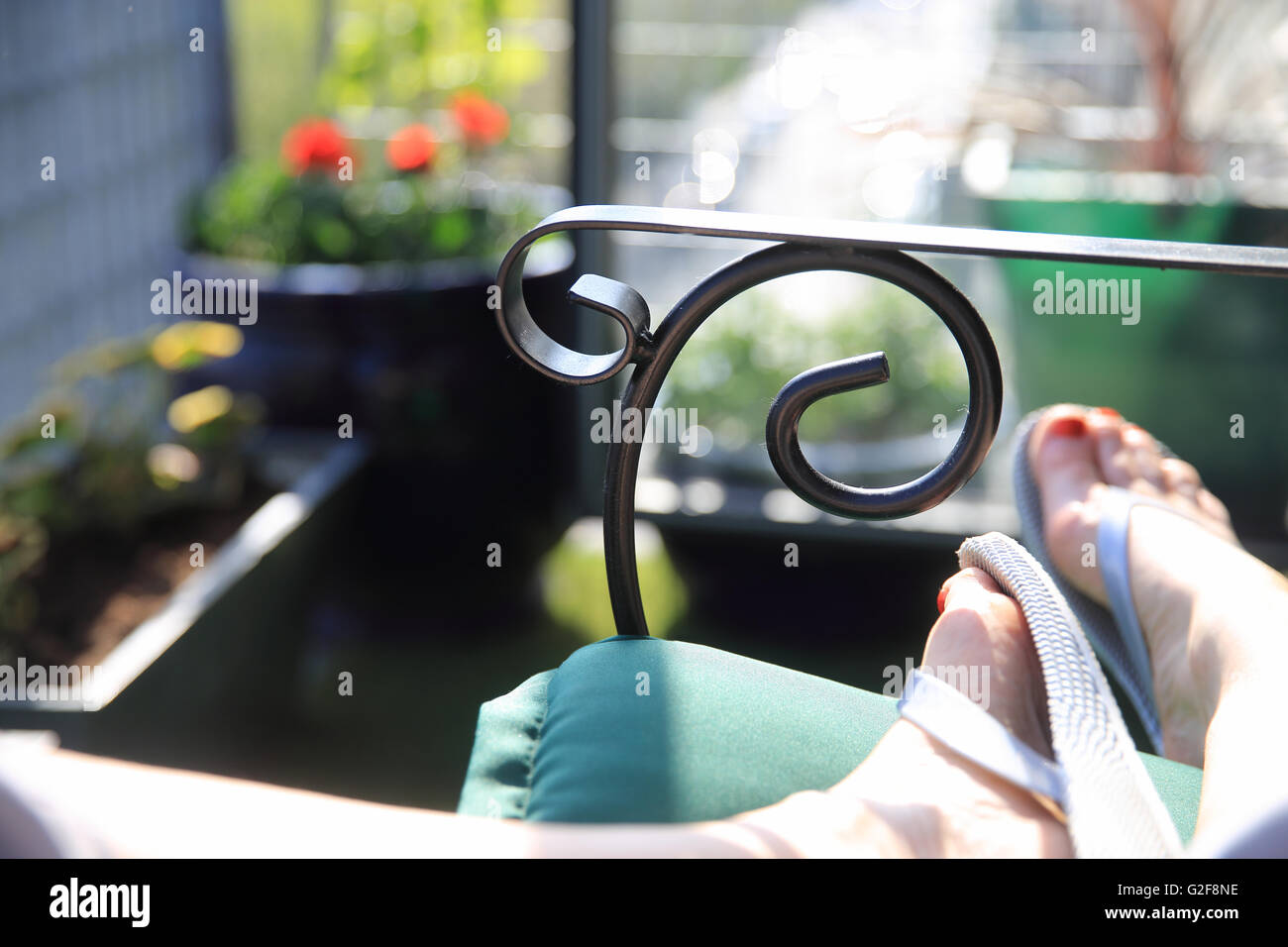 Relaxing on a balcony in summer, in London, England, UK Stock Photo