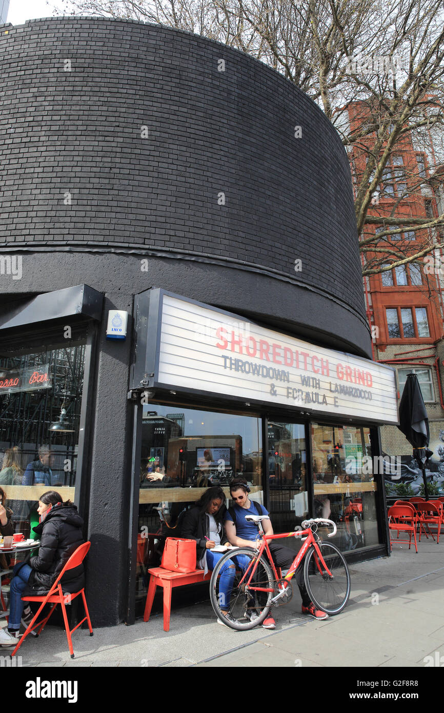 The Shoreditch Grind, a coffee shop and bar, with a 1950s diner-style facade, on Old Street Roundabout in East London, England Stock Photo