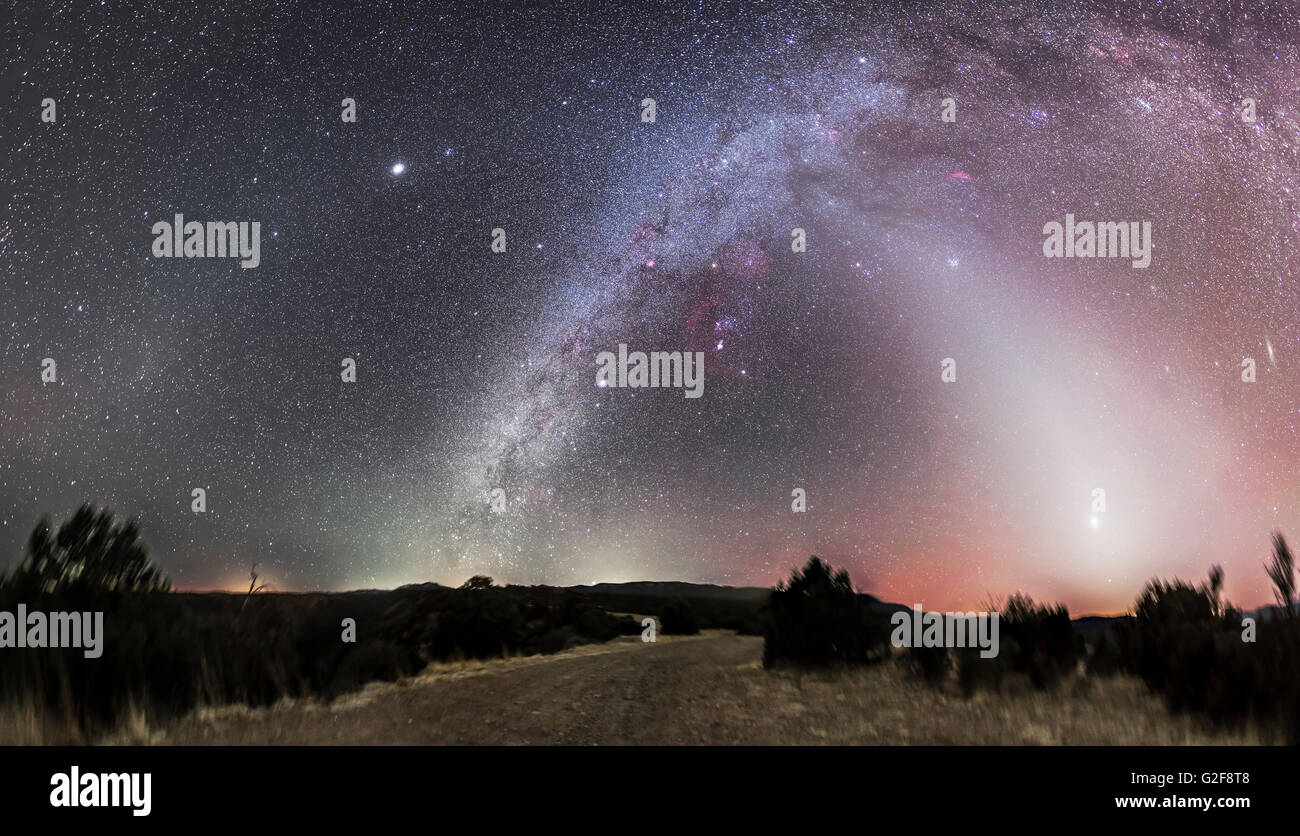 A 160 degree panorama showing the zodiacal light (at right in the west), the Milky Way, the zodiacal band across the frame at to Stock Photo