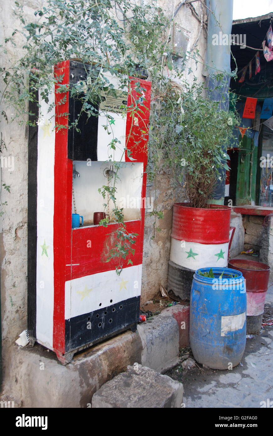 Aleppo - Street in the Old City With Syrian Flag Painted Fountain Stock Photo