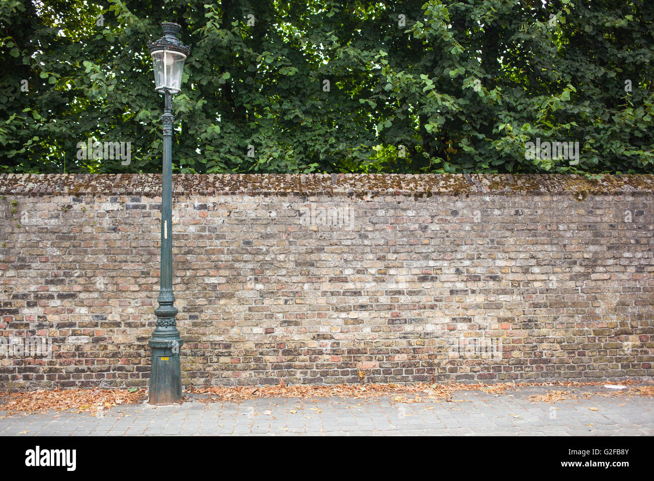 lamp post street on the left on brick wall background stock photo