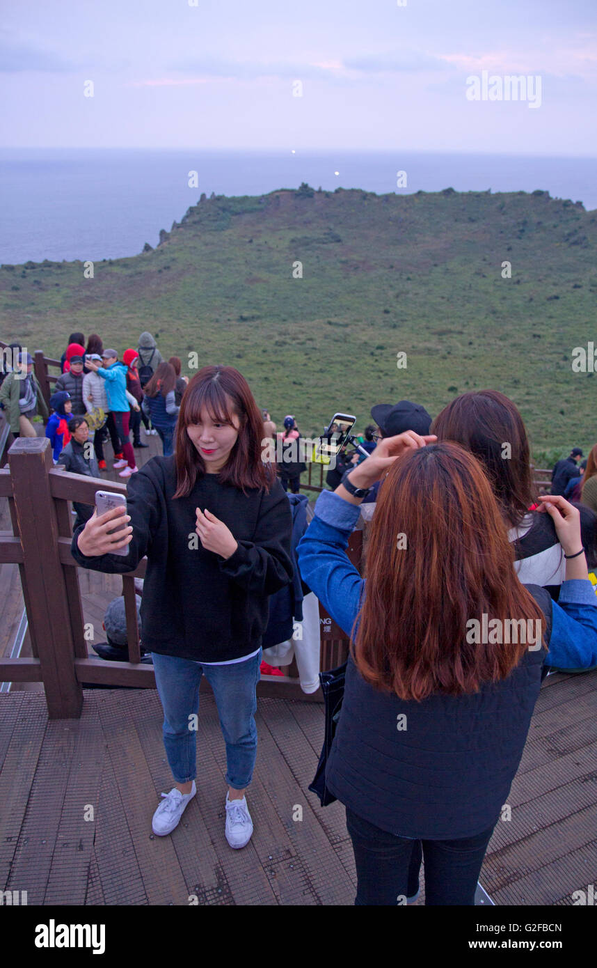 Selfies on the summit of Seongsan Sunrise Peak Stock Photo