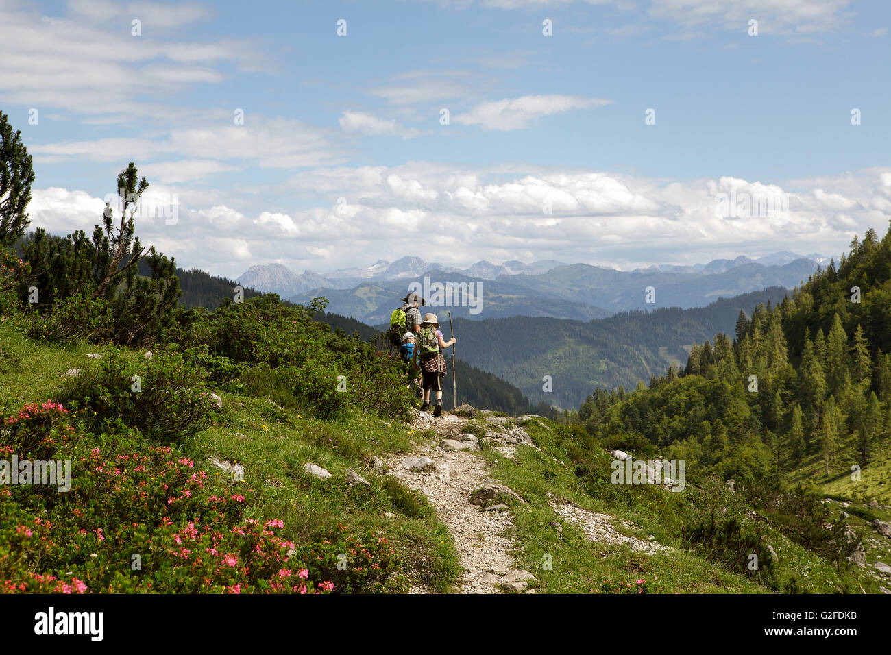 Father with son and daughter on hiking trip in the european alps Stock Photo