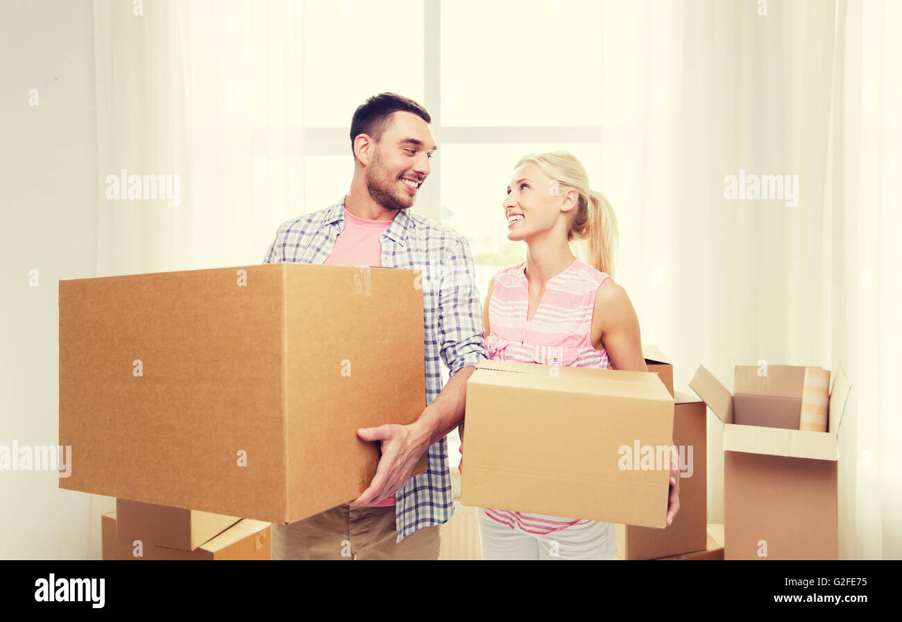 couple with big cardboard boxes moving to new home Stock Photo - Alamy
