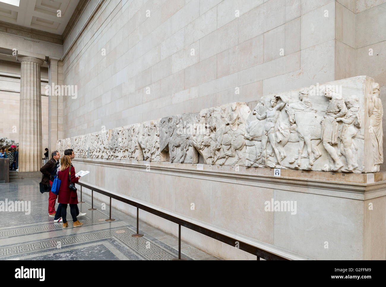 Visitors looking at The Parthenon Sculptures or 'Elgin Marbles', Ancient Greece and Rome Galleries, British Museum, Bloomsbury, London, England, UK Stock Photo