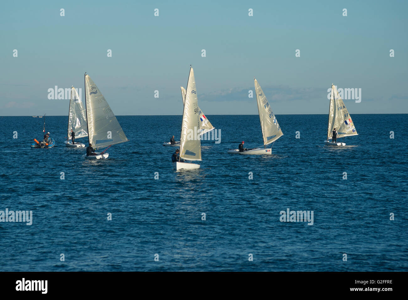 Finn class dinghy sailors training in Lagos Portugal Stock Photo