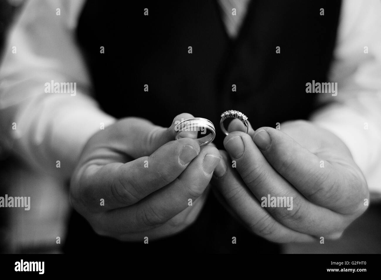 Man Holding Two Wedding Rings Stock Photo Alamy