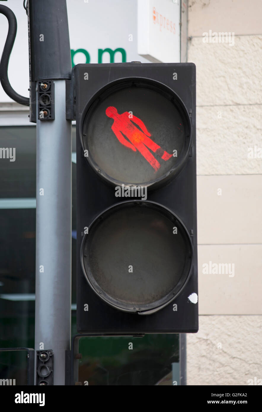 british pelican crossing with pictogram of red man at unusual angle, kingston upon thames, surrey, england Stock Photo