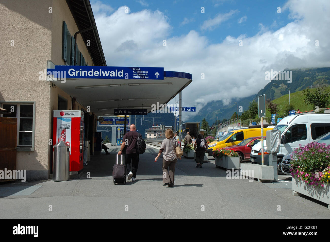 Grindelwald, Switzerland - August 19, 2014: Unidentified people walking at railway station in Grindelwald in Alps in Switzerland Stock Photo
