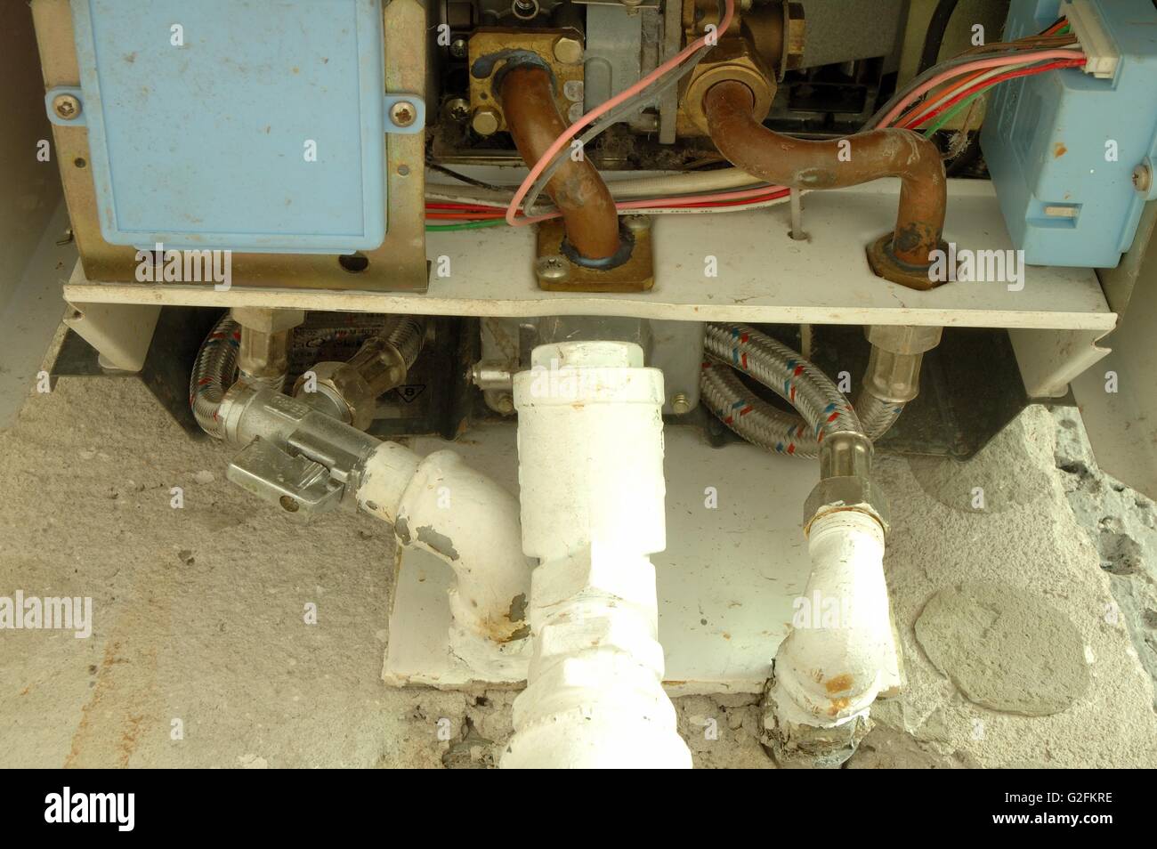 Gas and water pipes connected to heating device Stock Photo Alamy