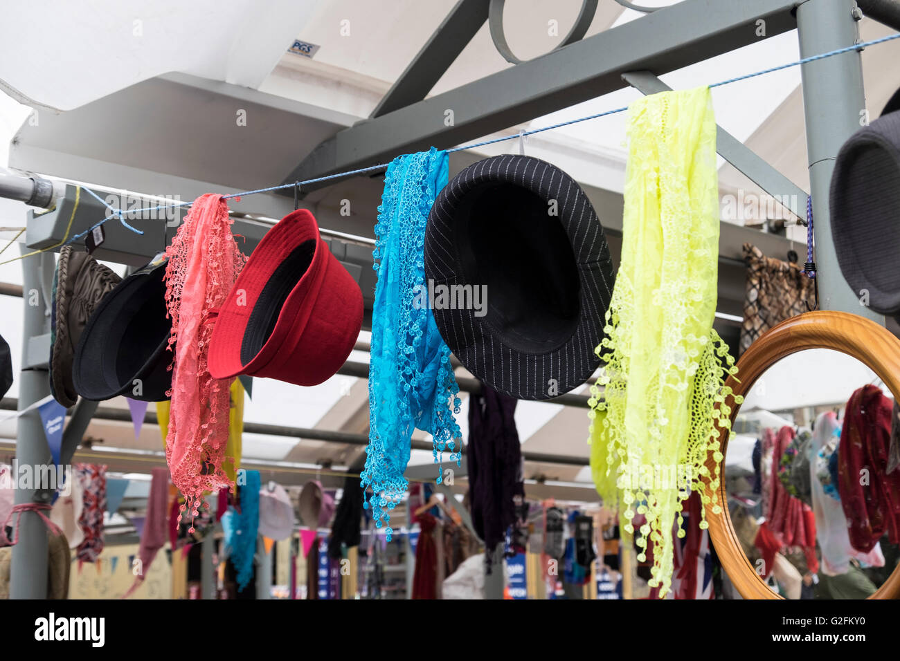 Market stall with colourful hats and scarves Stock Photo