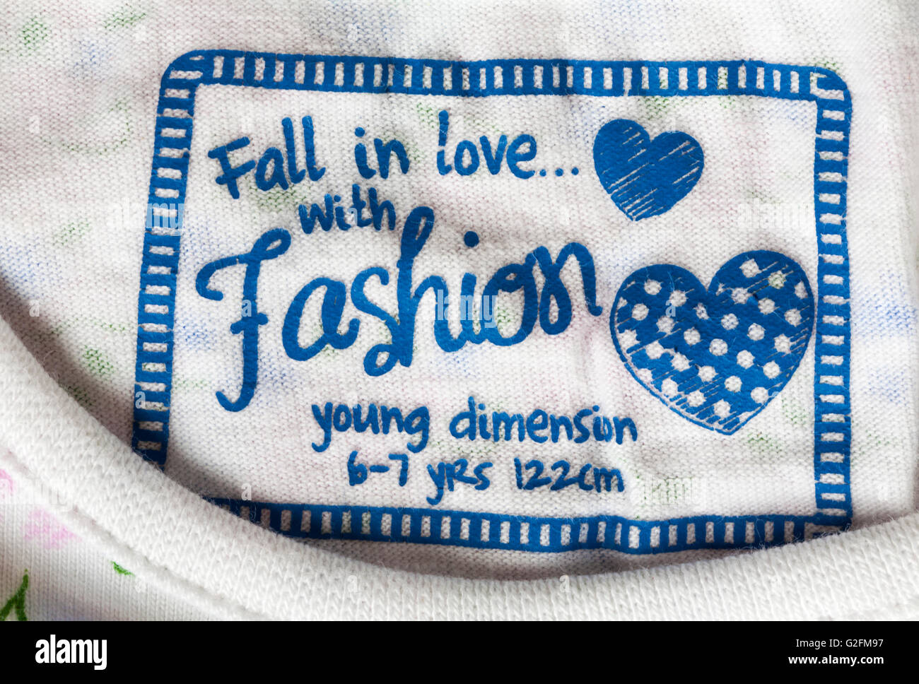 fall in love with fashion label in young dimension girls top Stock Photo