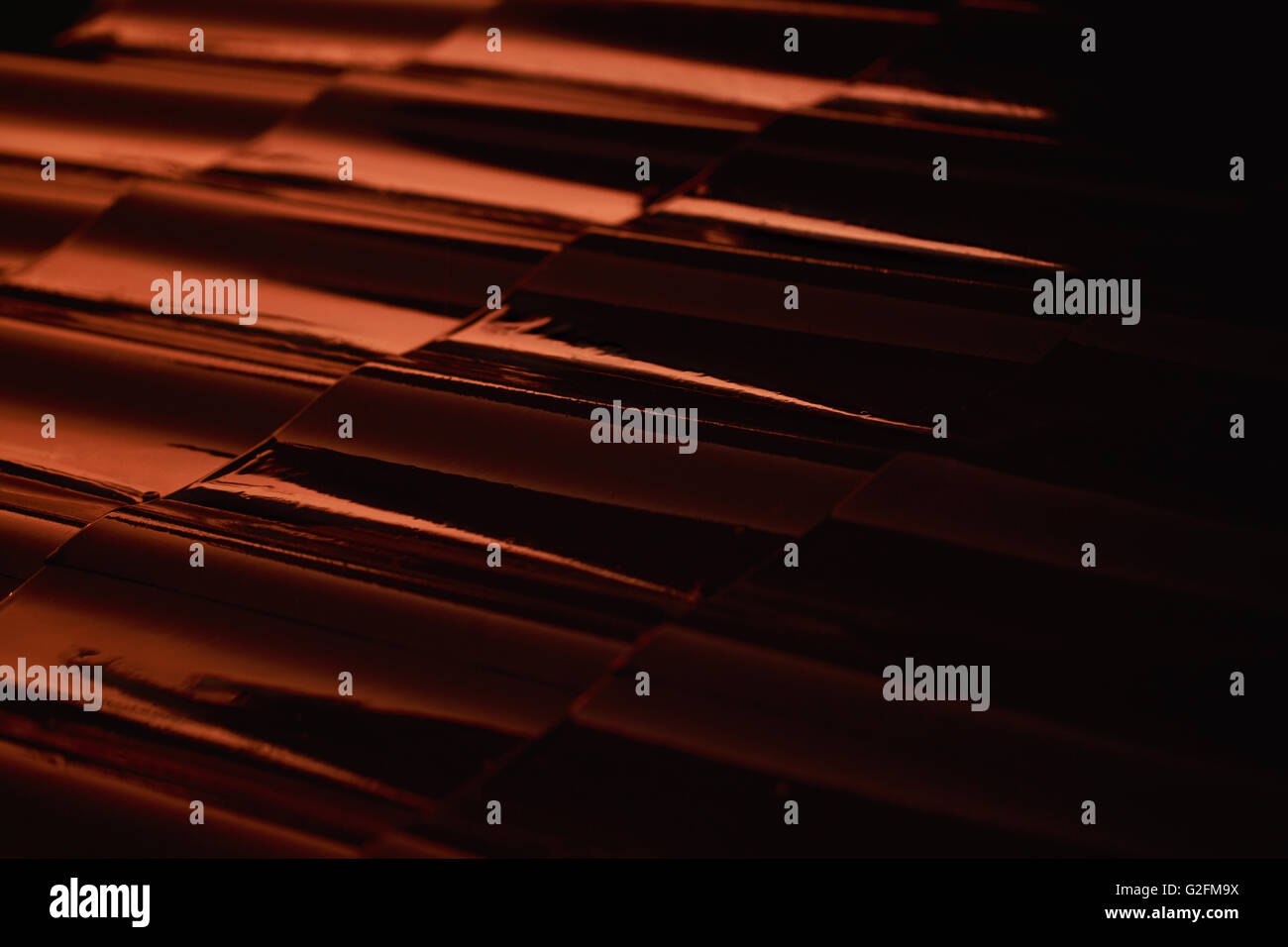 Abstract closeup metal profile roof-tile at sunset. Stock Photo