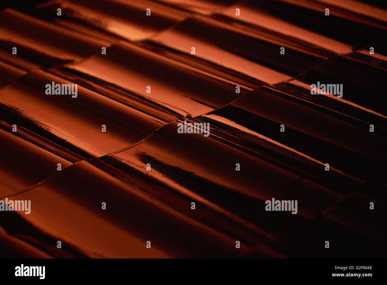 Abstract closeup metal profile roof-tile at sunset. Stock Photo