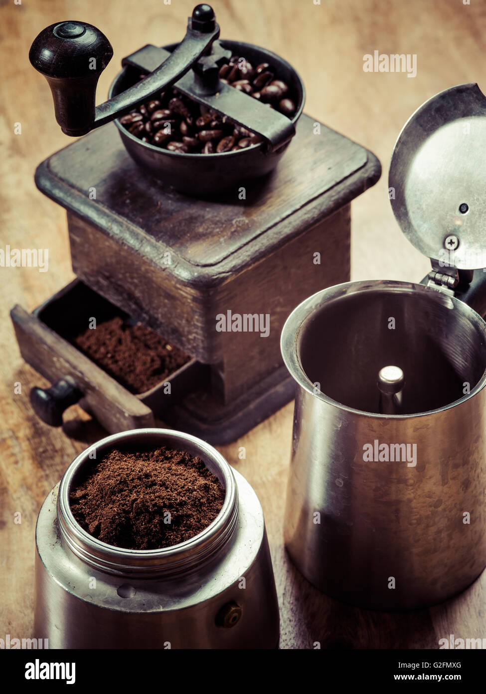 Photo of an Italian Moka Express stovetop coffee maker and a coffee grinder Stock Photo Alamy