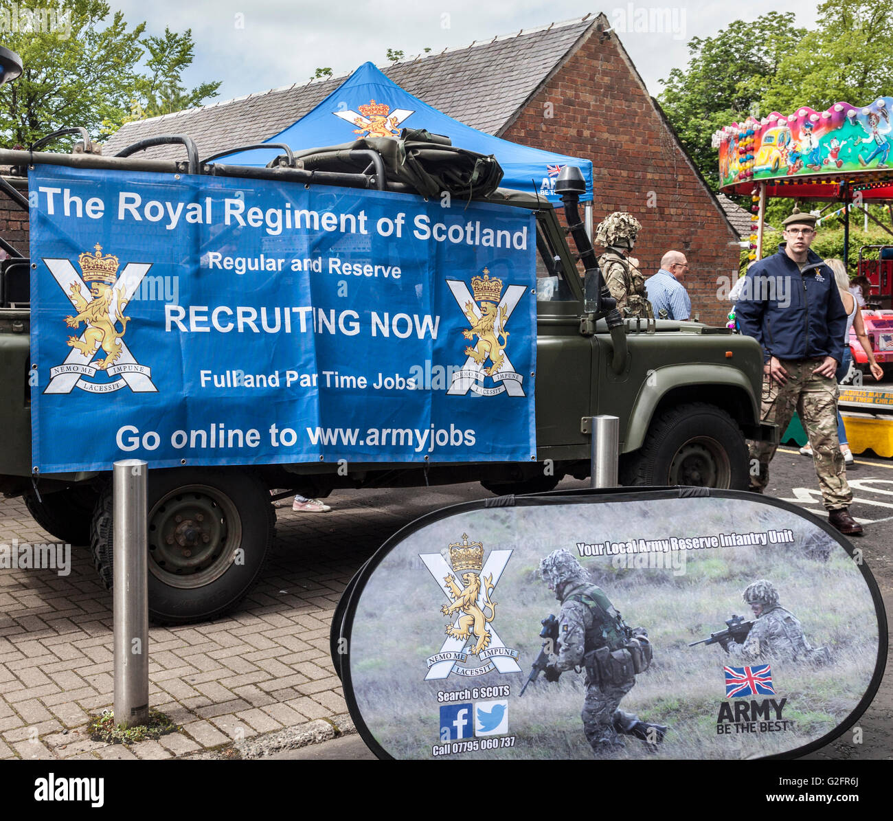 Banners encouraging recruitment for the Royal Regiment of Scotland, at Mauchline Holy Fair, South Ayrshire, Scotland, UIK Stock Photo