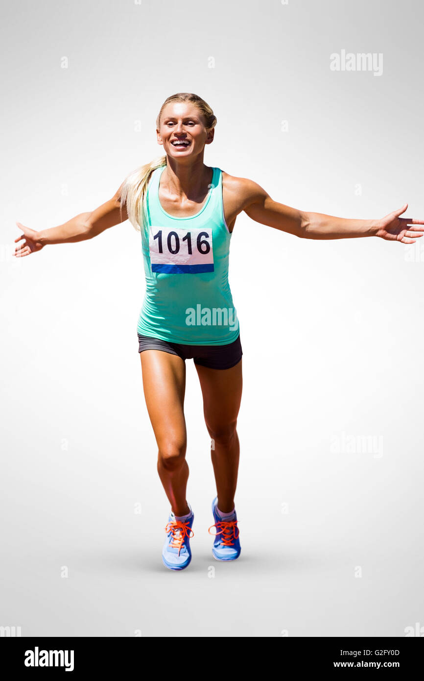 Sportswoman finishing her run Stock Photo