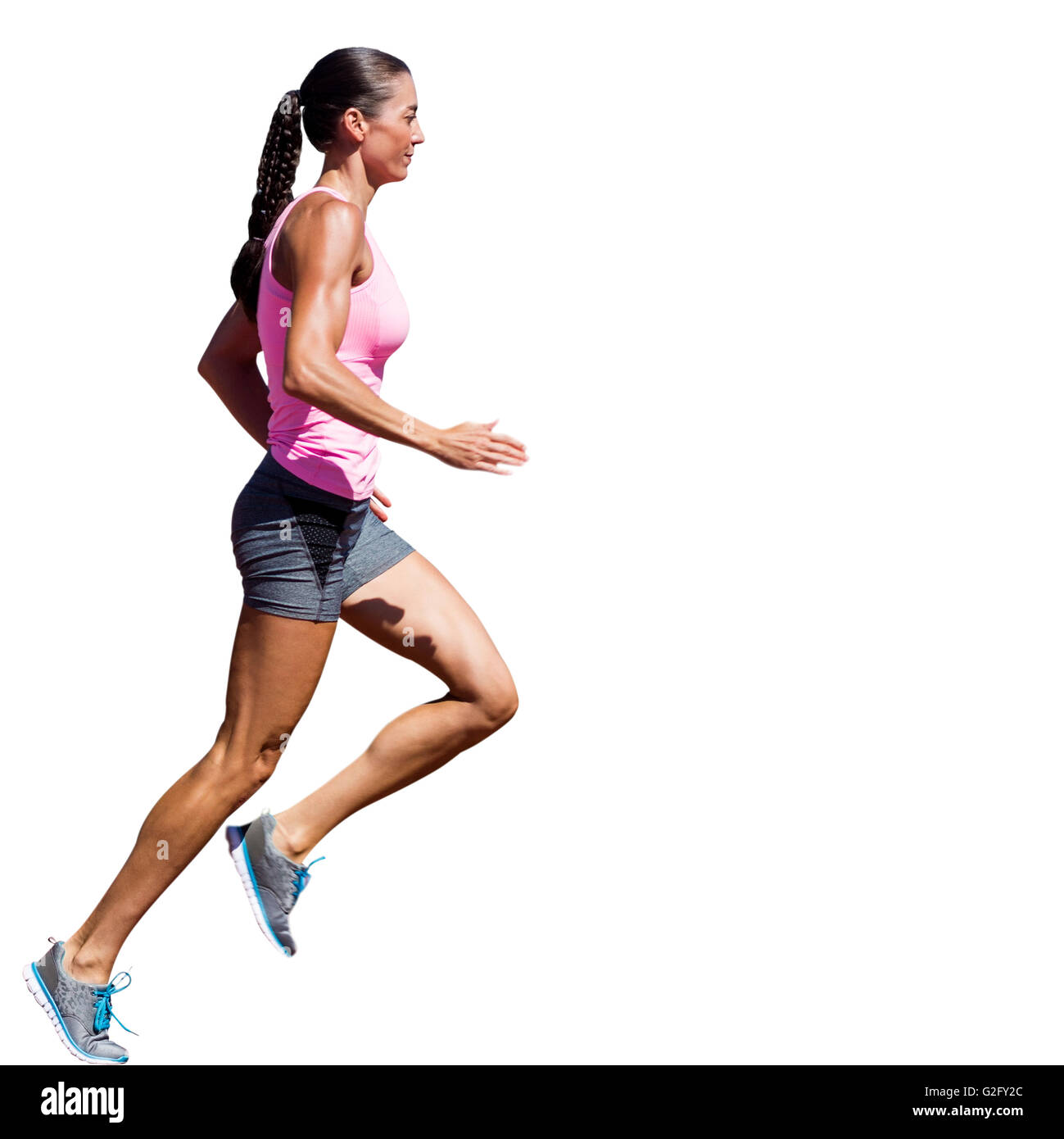 Profile view of sportswoman running Stock Photo