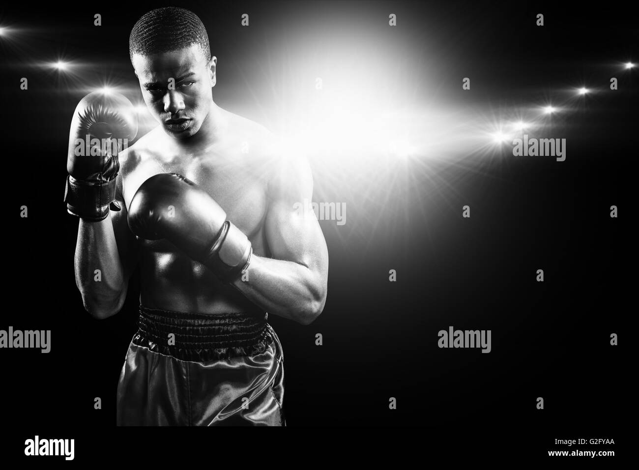 Composite image of portrait of boxer performing uppercut Stock Photo