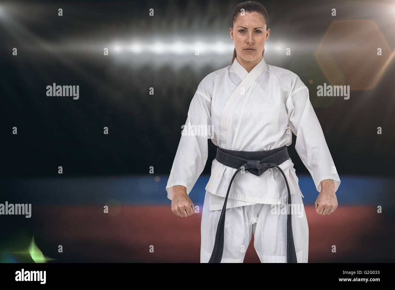 Composite image of female karate player posing on white background Stock Photo