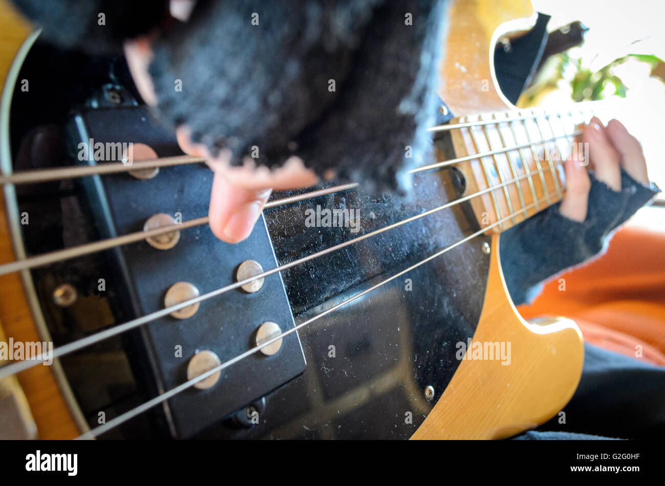 Fingers playing bass guitar Stock Photo Alamy