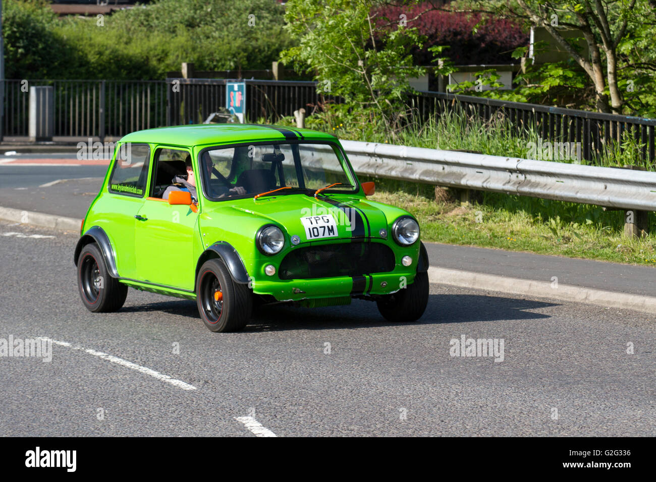1973 998cc Green Mini 1000 , side view motion blur; at Pendle Power Fest, a classic cars, veteran and heritage, 70s cherished oldtimers motor show in Lancashire, UK Stock Photo