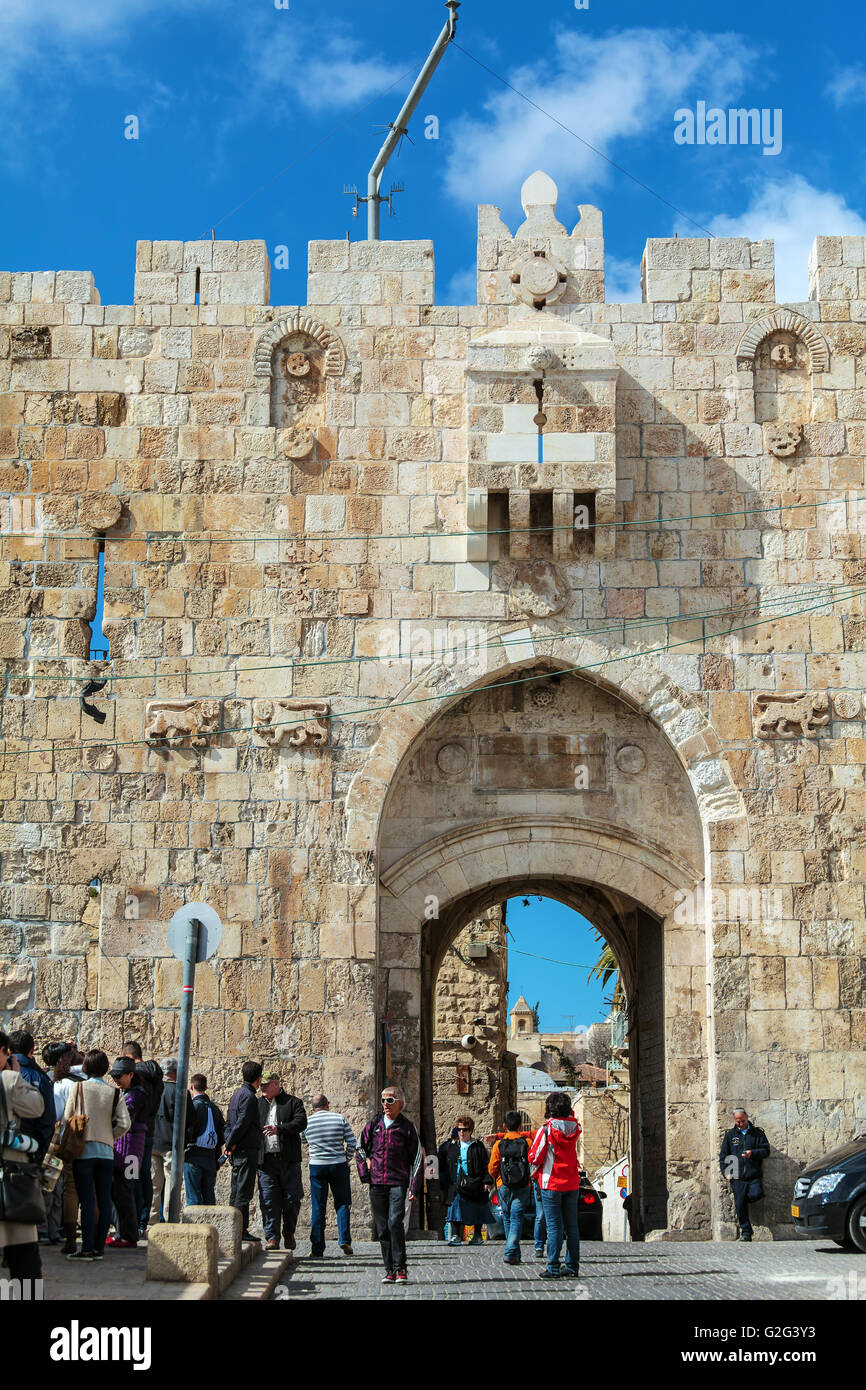 JERUSALEM, ISRAEL - FEBRUARY 20, 2013: Tourists walking near Lions gate of old city Stock Photo