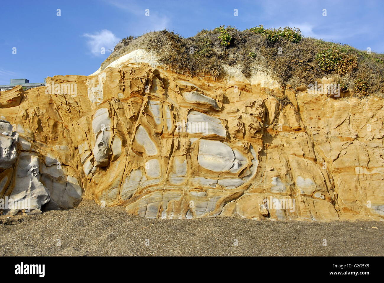 Colorful cliff side bluff on Moonstone Beach in the town of Cambria, California Stock Photo