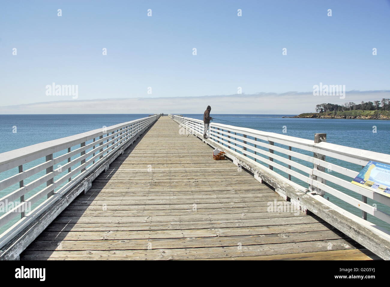 Fishing off the San Simeon Pier at William Randolf Hearst State Beach in San Simeon, California Stock Photo