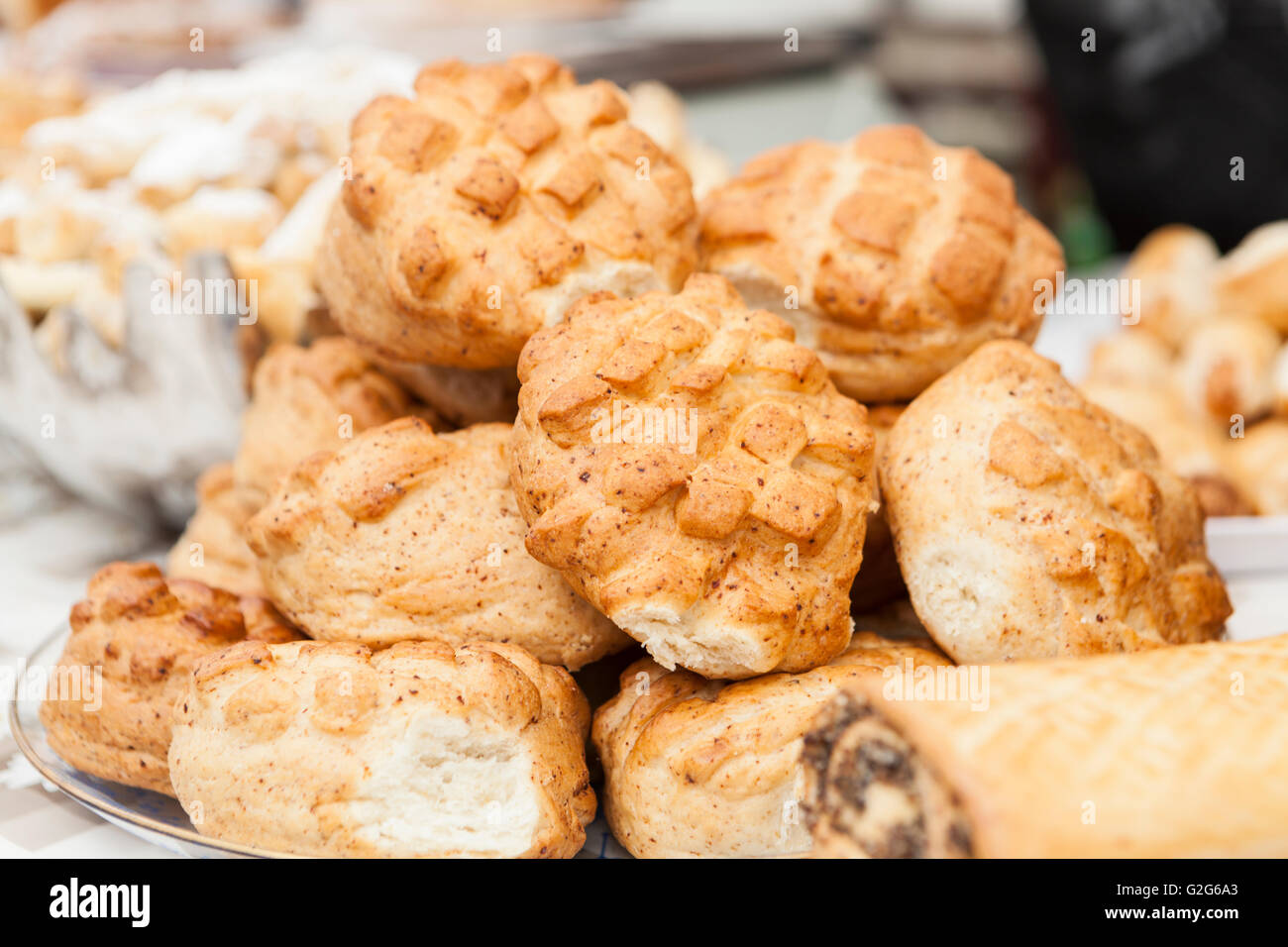 home made brown tasty buns on plate Stock Photo